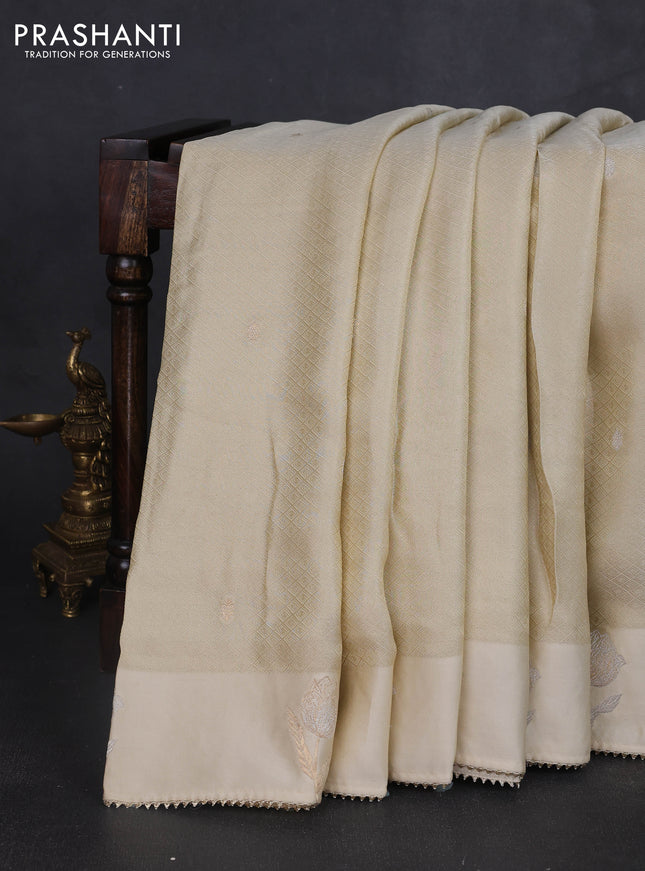 Banarasi silk saree cream with allover zari woven brocade weaves and mirror embroidery pallu & zari woven butta border