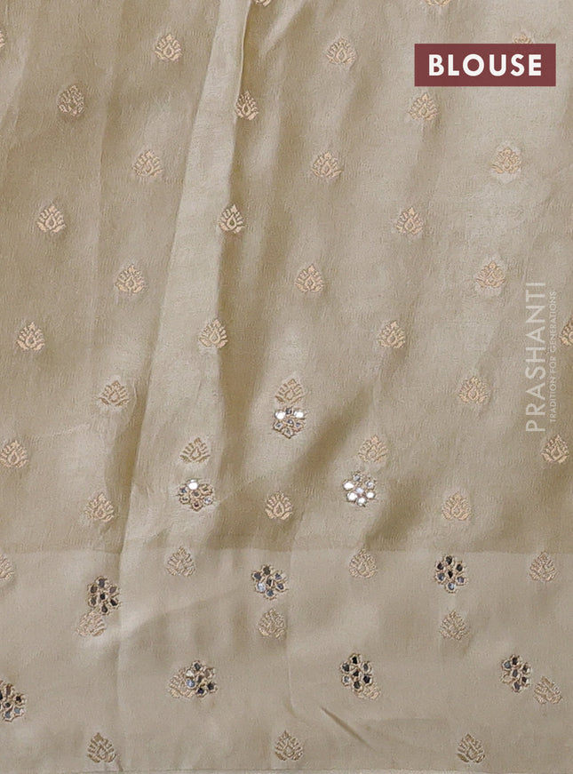 Banarasi silk saree cream with allover zari woven brocade weaves and mirror embroidery pallu & zari woven butta border