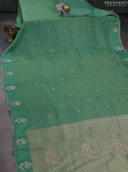 Banarasi silk saree teal green with allover zari woven brocade weaves and mirror embroidery pallu & zari woven butta border