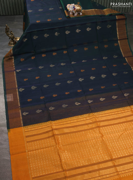 Kora silk cotton saree dual shade of bluish green and mustard yellow with thread & zari woven buttas and zari woven border