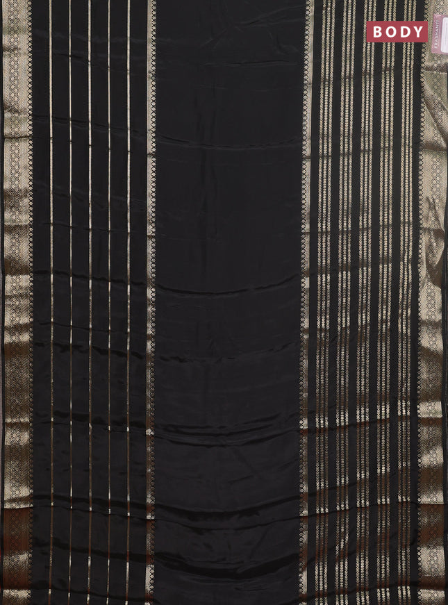 Semi mysore silk saree black and rustic orange with plain body and long zari woven border