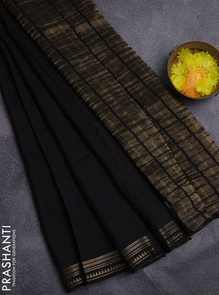 Semi mysore silk saree black and rustic orange with plain body and zari woven border