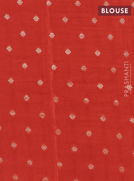 Semi mysore silk saree black and rustic orange with plain body and zari woven border