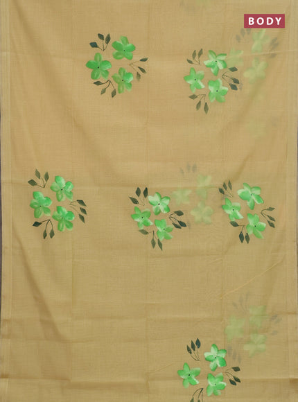 Linen cotton saree sandal and light green with floral hand paint prints and zari woven border