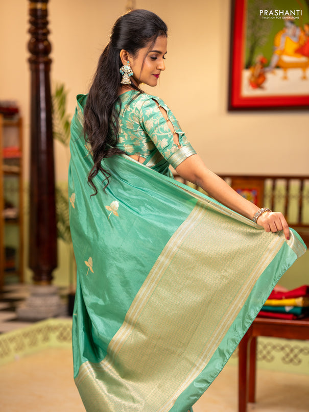 Semi raw silk saree teal green with zari woven buttas and zari woven border