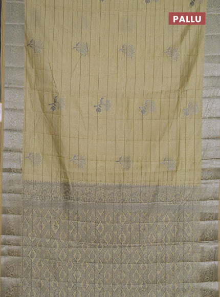 Semi raw silk saree pale yellow with allover thread &zari weaves & buttas and silver zari woven border