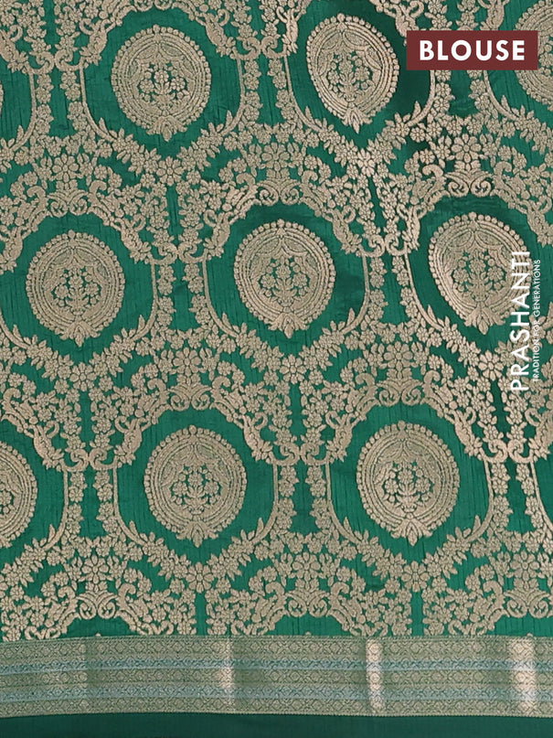 Semi raw silk saree bottle green with zari woven buttas and zari woven border