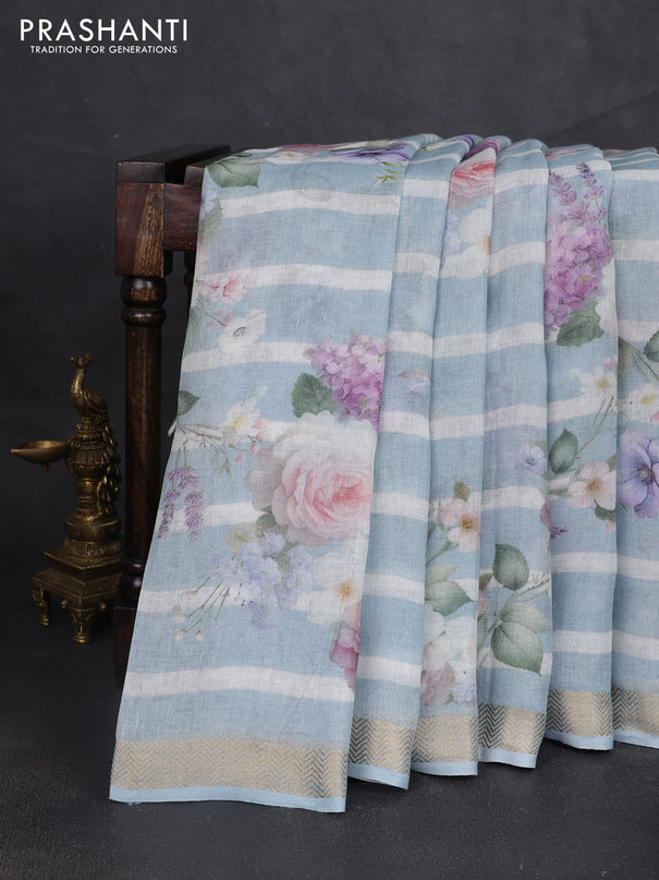 Pure linen saree pastel blue and off white with allover floral digital prints and zari woven border