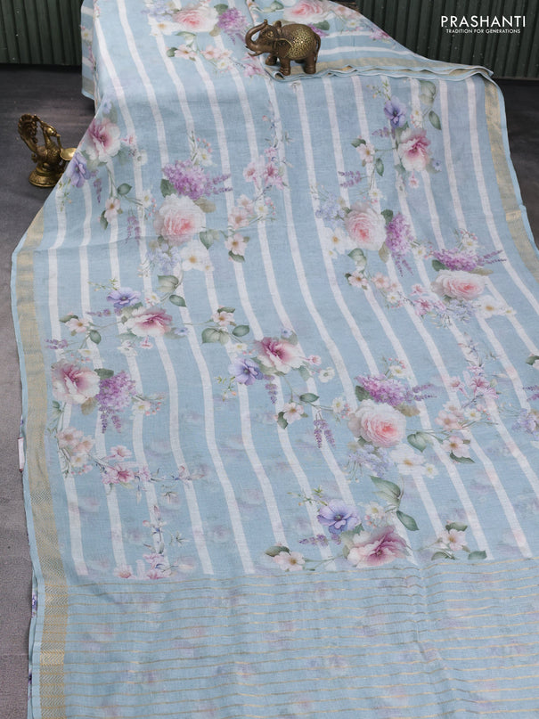 Pure linen saree pastel blue and off white with allover floral digital prints and zari woven border