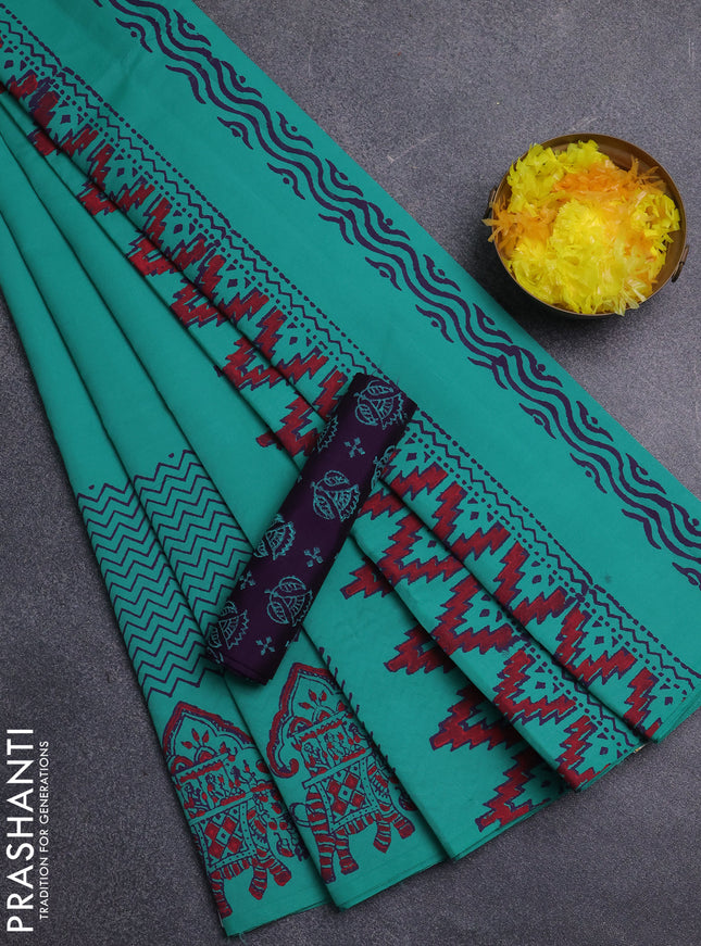 Semi silk cotton saree teal green and purple with plain body and printed border