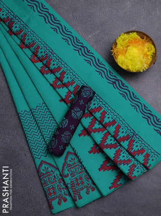 Semi silk cotton saree teal green and purple with plain body and printed border