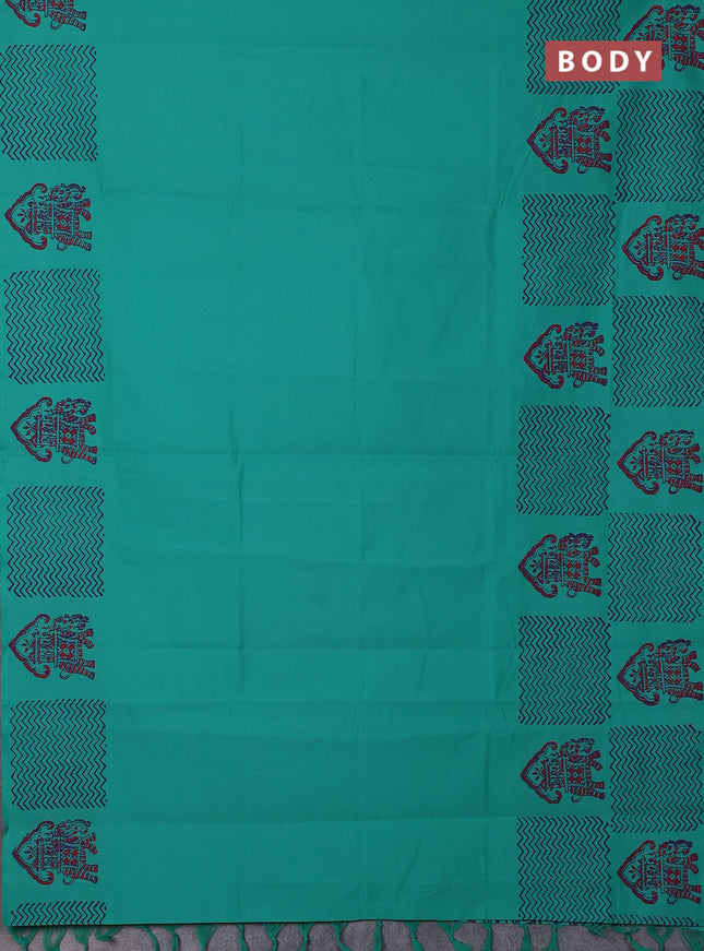 Semi silk cotton saree teal green and purple with plain body and printed border