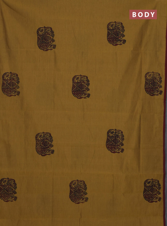 Semi silk cotton saree dark mustard and maroon with elephant butta prints and butta printed border