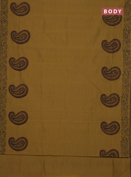 Semi silk cotton saree mustard green shade and black with paisley butta prints and printed border