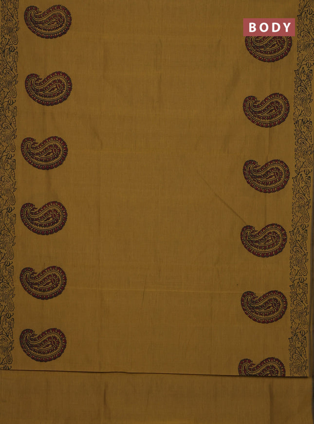 Semi silk cotton saree mustard green shade and black with paisley butta prints and printed border