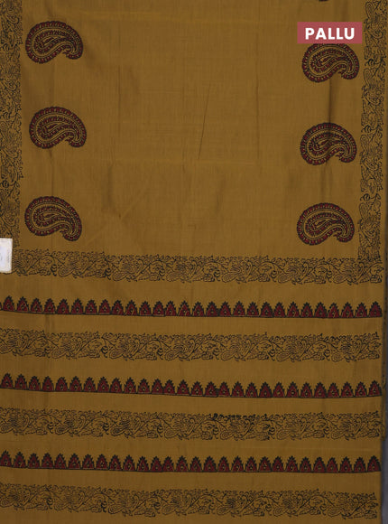 Semi silk cotton saree mustard green shade and black with paisley butta prints and printed border