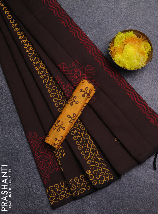 Semi silk cotton saree brown and yellow with rangoli butta prints and printed border