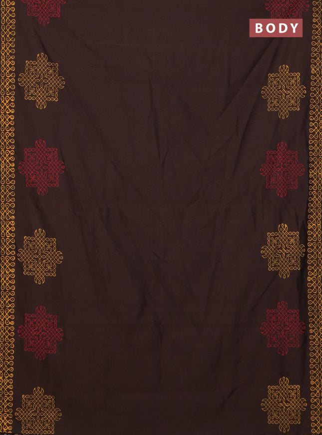 Semi silk cotton saree brown and yellow with rangoli butta prints and printed border