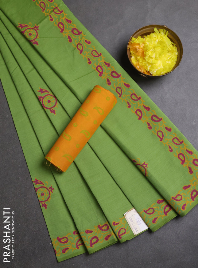 Semi silk cotton saree light green and yellow with butta prints and printed border