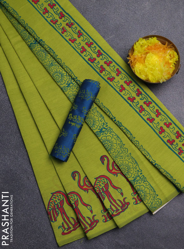 Semi silk cotton saree fluorescent green and cs blue with plain body and butta printed border