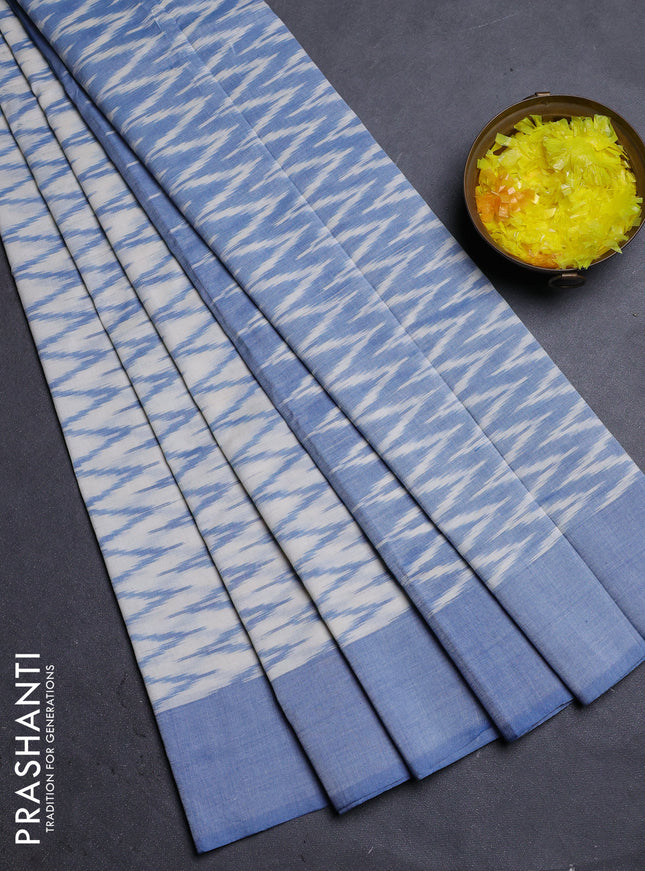 Ikat cotton saree cream and blue with allover ikat zig zag weaves and simple border