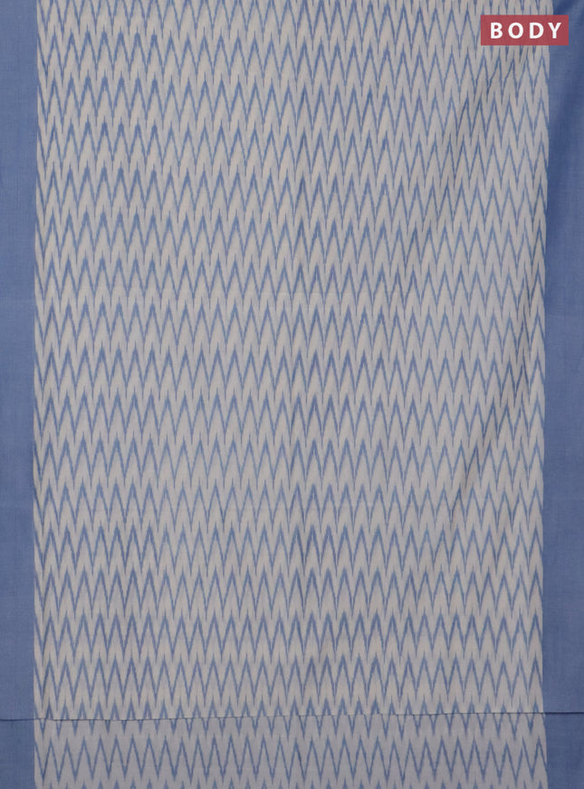 Ikat cotton saree cream and blue with allover ikat zig zag weaves and simple border