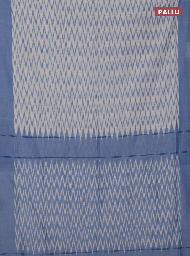 Ikat cotton saree cream and blue with allover ikat zig zag weaves and simple border