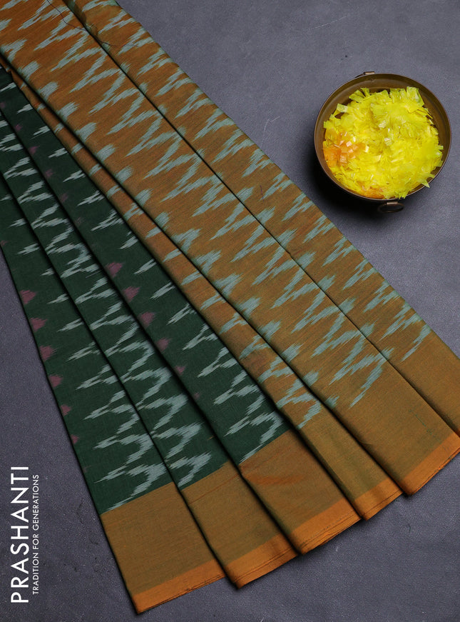 Ikat cotton saree bottle green and dark mustard with allover ikat zig zag weaves and simple border