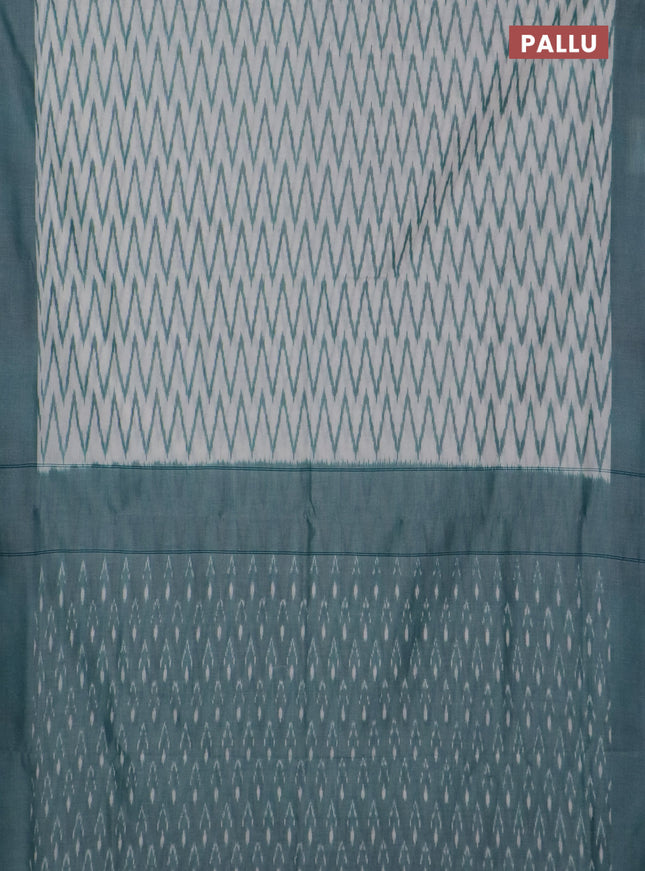 Ikat cotton saree off white and teal green with allover ikat zig zag weaves and simple border