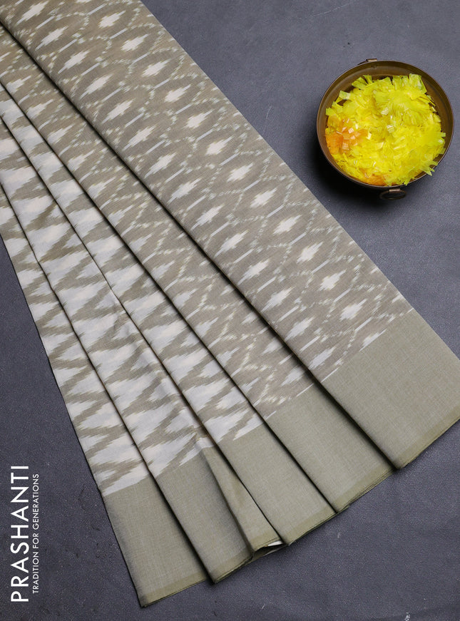 Ikat cotton saree cream and pastel green with allover ikat zig zag weaves and simple border