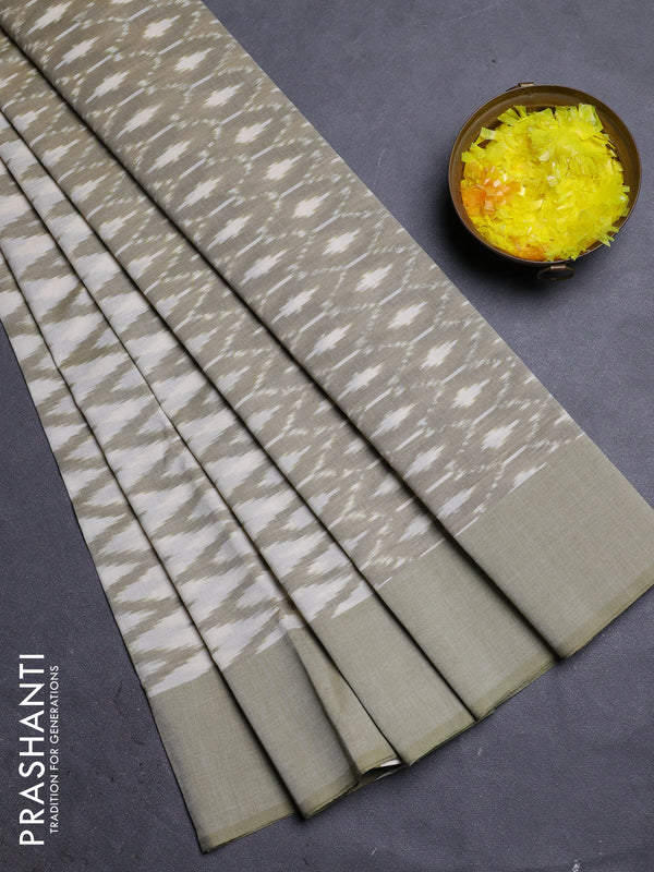 Ikat cotton saree cream and pastel green with allover ikat zig zag weaves and simple border