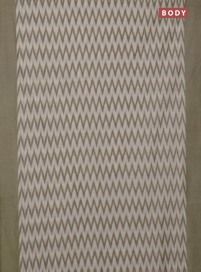 Ikat cotton saree cream and pastel green with allover ikat zig zag weaves and simple border