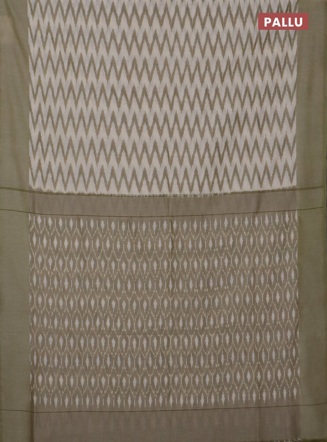 Ikat cotton saree cream and pastel green with allover ikat zig zag weaves and simple border