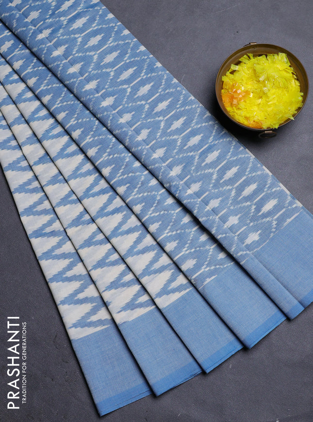 Ikat cotton saree cream and blue with allover ikat zig zag weaves and simple border