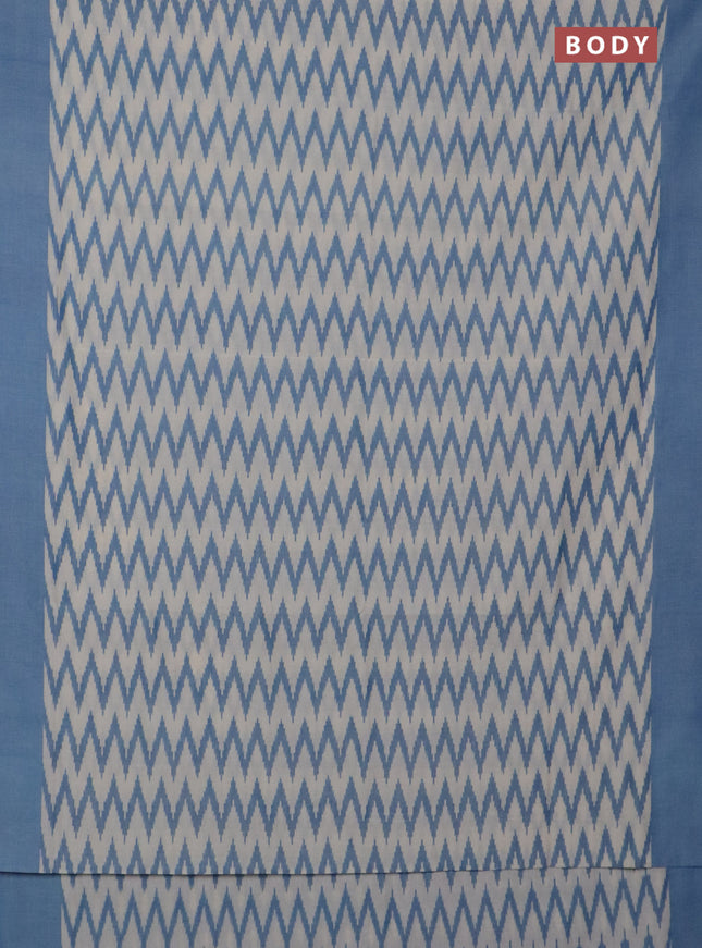 Ikat cotton saree cream and blue with allover ikat zig zag weaves and simple border