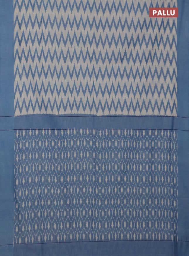 Ikat cotton saree cream and blue with allover ikat zig zag weaves and simple border