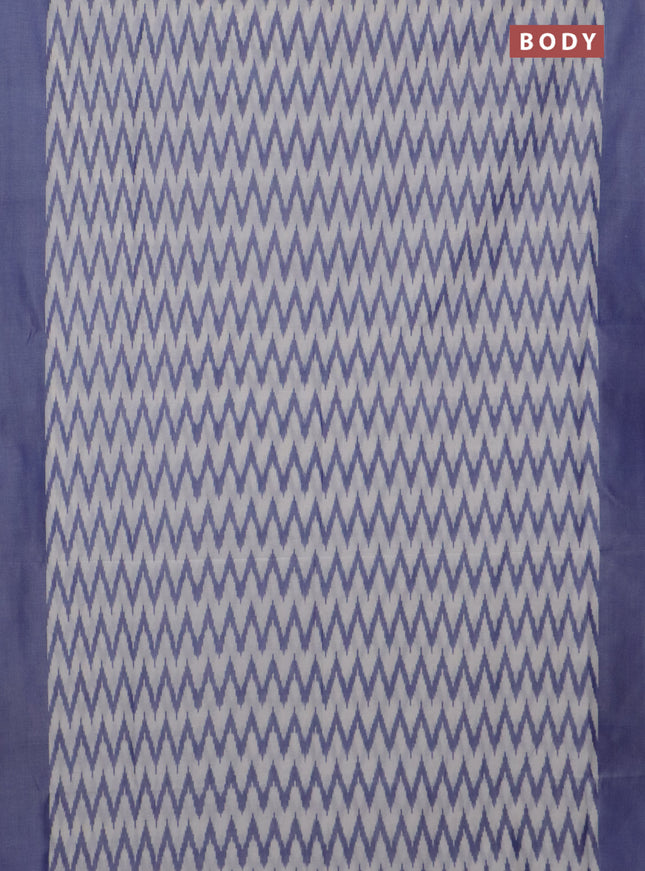 Ikat cotton saree off white and blue shade with allover ikat zig zag weaves and simple border