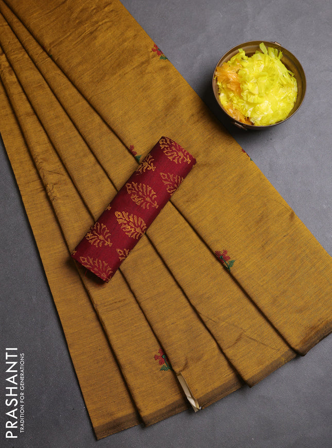 Semi silk cotton saree dark mustard and maroon with embroidery buttas in borderless style