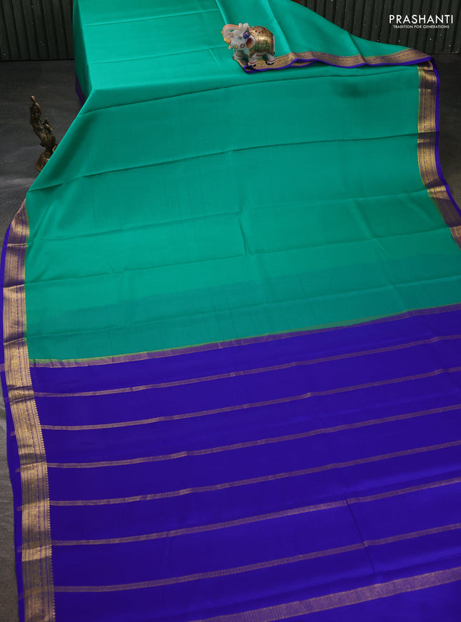 Pure mysore silk sareee teal green and royal blue with plain body and zari woven border