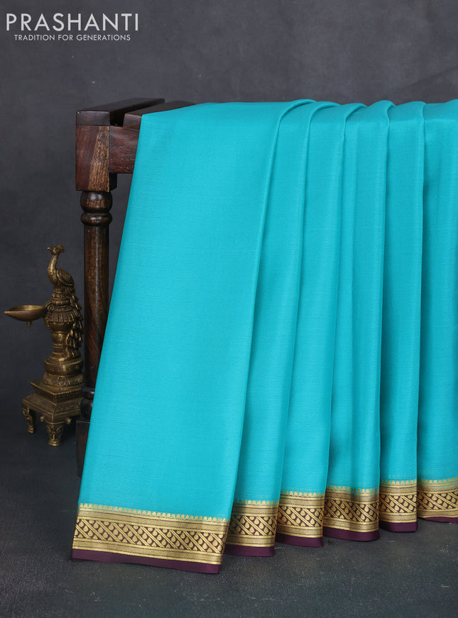 Pure mysore silk sareee teal blue and wine shade with plain body and zari woven border