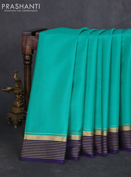 Pure mysore silk sareee teal green and navy blue with plain body and zari woven border