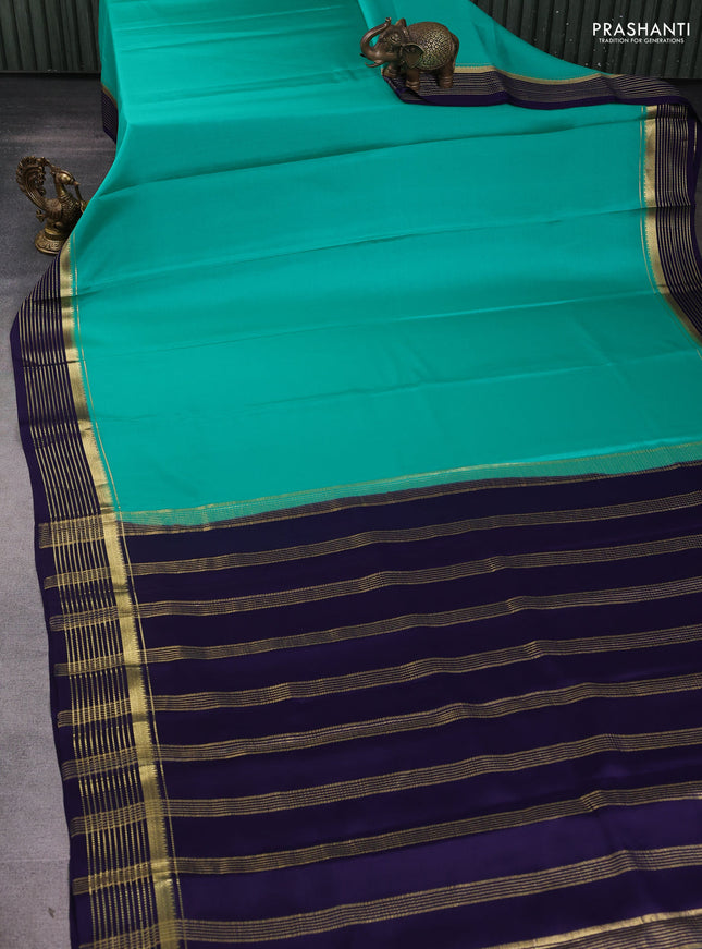 Pure mysore silk sareee teal green and navy blue with plain body and zari woven border