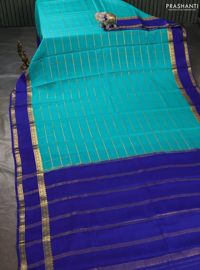 Pure mysore silk sareee teal shade and blue with allover zari woven checked pattern and rettapet zari woven border