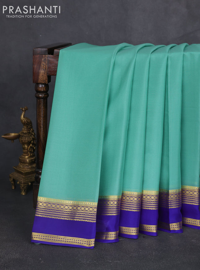 Pure mysore silk sareee teal green shade and blue with plain body and zari woven border