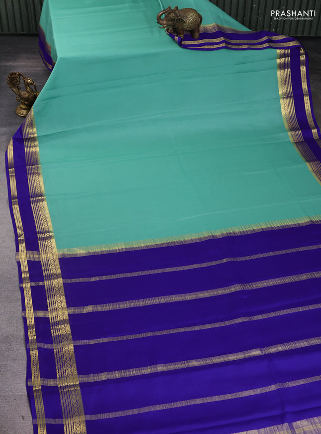 Pure mysore silk sareee teal green shade and blue with plain body and zari woven border