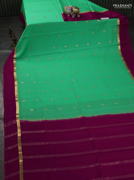 Pure mysore silk sareee teal green shade and dark pink with zari woven buttas and zari woven simple border