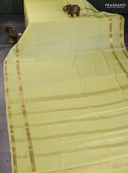 Pure mysore silk sareee pale yellow with plain body and rettapet zari woven border