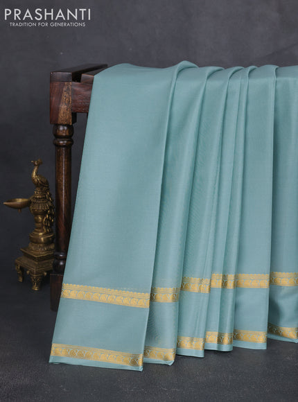 Pure mysore silk sareee pastel green with plain body and rettapet zari woven border