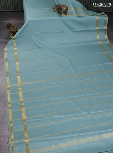 Pure mysore silk sareee pastel green with plain body and rettapet zari woven border