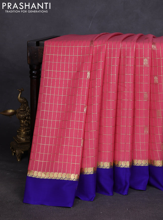 Pure mysore silk sareee peach pink shade and blue with allover zari woven checked pattern and zari woven simple border
